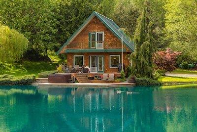 Forrest green Standing seam metal roof and the water