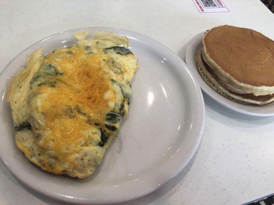 Cheddar and spinach omelette, and famous pancakes and freshly squeezed OJ