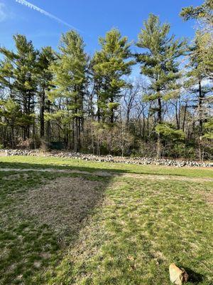 Green Grass, Trees & The Road & Parking behind the church with glacier rocks @ Martha Mary Chapel @ Longfellow's Wayside Inn Sudbury MA.