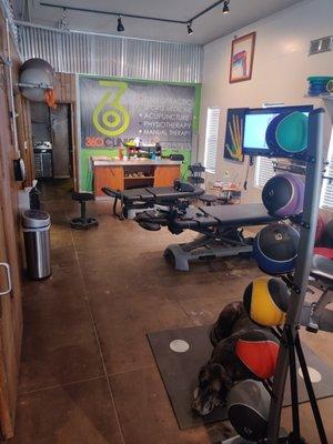 Open concept physical therapy bay and chiropractic tables