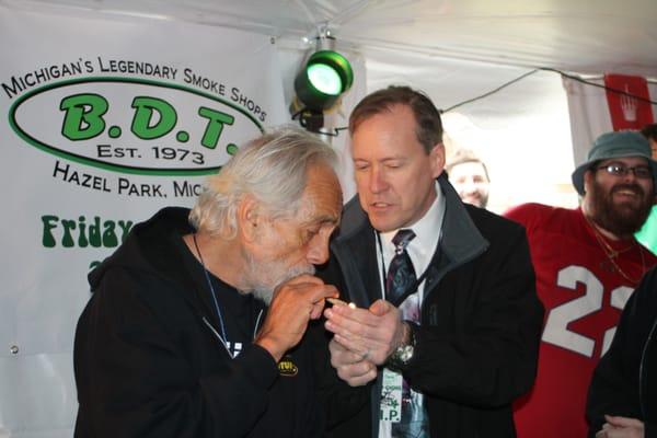 Tommy Chong with Councilman Andrew LeCureaux.  Andy is helping Tommy with a much needed light.