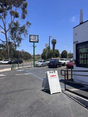 Look for the Collision Fix sign - the station is tucked in that lot.