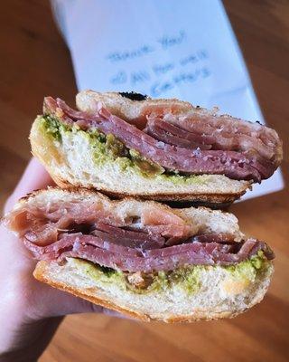 T & Bree Sandwich: Prosciutto, salami, Brie, pickled golden raisins, fig chimichurri on ciabatta panini-style