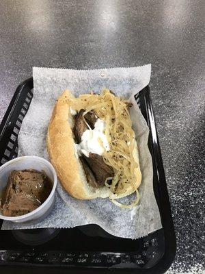 Braised brisket horseradish aioli basil pickled onions on a sub roll . Gotta have it