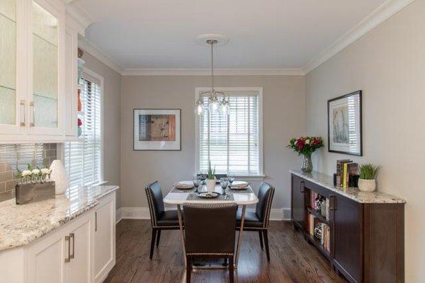 Classic Elegance V - The breakfast room features a buffet that matched the island and custom built breakfast table.