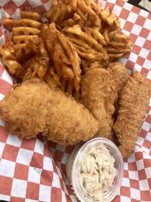 Chicken tenders and spicy waffle fries