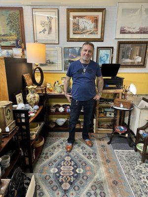 Vendor Robert A. standing in one of his booths.