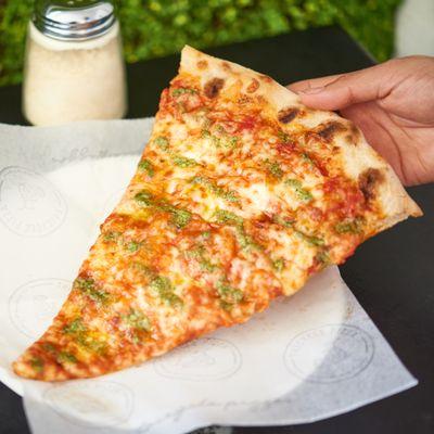 Cheese Pesto Pizza Slice. XL NY Style slices available 12pm-3pm.