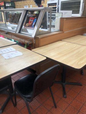 Tables in front of the service counter.  I assume this is to help prevent the spread of a Covid.