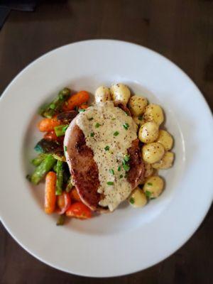 Seared Pork Ribeye, Gnocchi Sage mustard cream sauce, roasted Vegetables