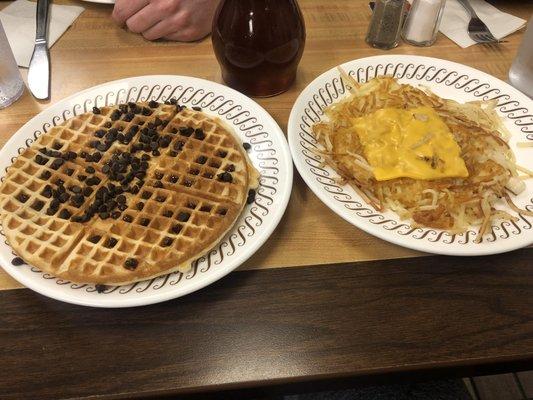 Chocolate chip waffle and hash browns with cheese and onions