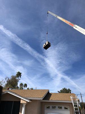 Taking an old unit off the roof and getting ready for the new one.