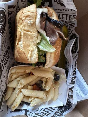 Roast beef and beer cheese sandwich with pasta salad