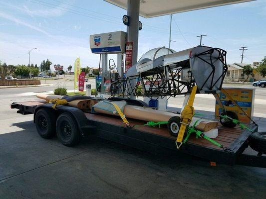 20ft flat bed trailer with a customers project plane.