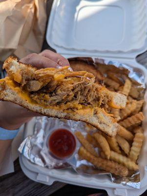 Inside view of mango habanero pulled pork grilled cheese sandwich