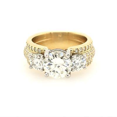 Custom designed 3 stone engagement ring with pave diamonds