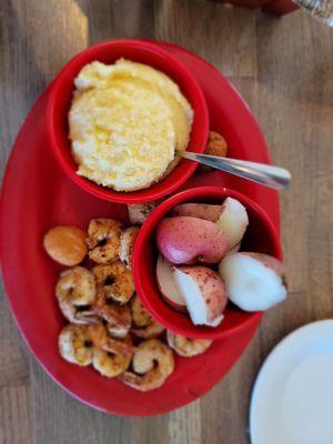 Grilled shrimp basket with new potatoes and cheese grits