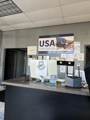 USA Auto Service sign inside lobby area.