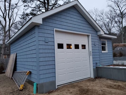 9x9 Insulated steel raise panel garage door with windows.