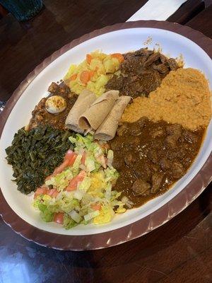 Lamb, beef and chicken with misor, gomen cabbage and salad.