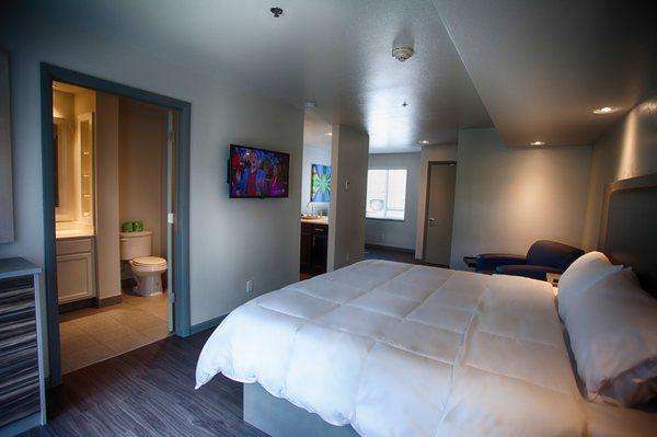 King size platform bed, chair/ottoman and flat screen tv in every room.