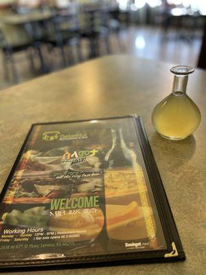 Menu and a glass of Tej (Honey Wine)