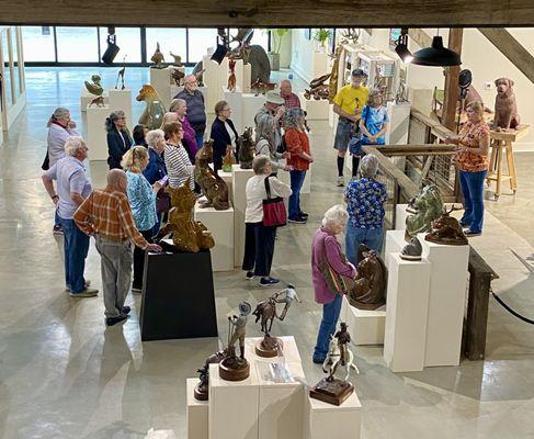 Tour group in main gallery learning about bronze casting