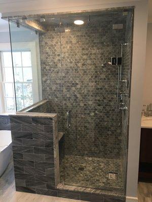 Custom glass shower enclosure with angle