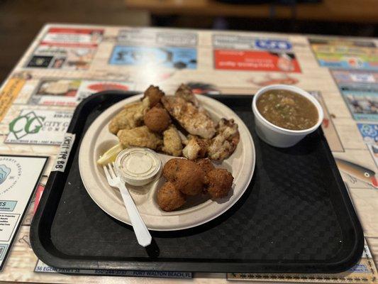 Cup of gumbo, grilled amberjack, grilled shrimp, fried oysters, and hush puppies.