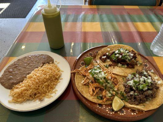 Taco assortment with beans and rice