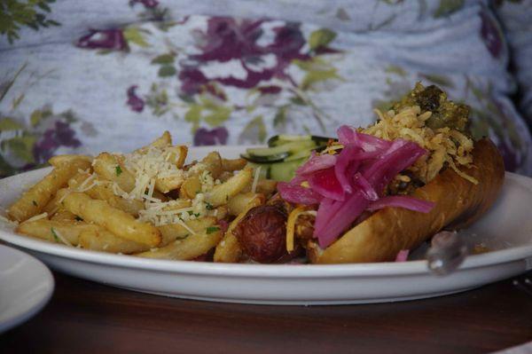 Bacon-wrapped chili dog with garlic-parmesan fries.