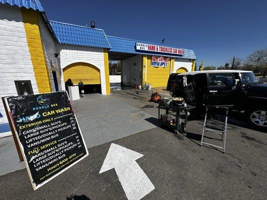 They're open and ready for business! They're just starting out but they're friendly and ready to wash cars by hand.