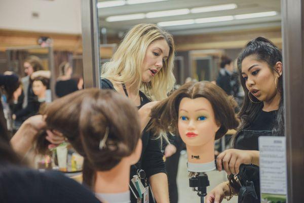 Student working on mannequin head