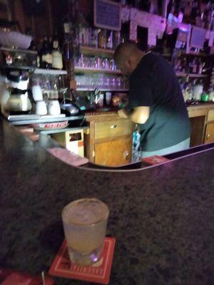 Friendly bartender with my tequila pineapple!