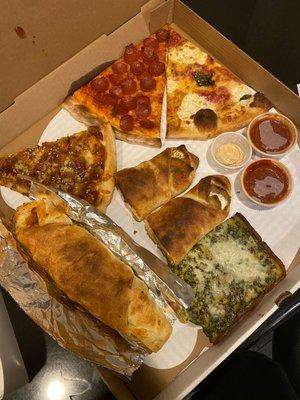 Sesame Chicken Slice, Pepperoni Slice, Margherita Slice, Spinach and Artichoke Slice, Eggplant and Ricotta Roll, and Chicken Parm Roll