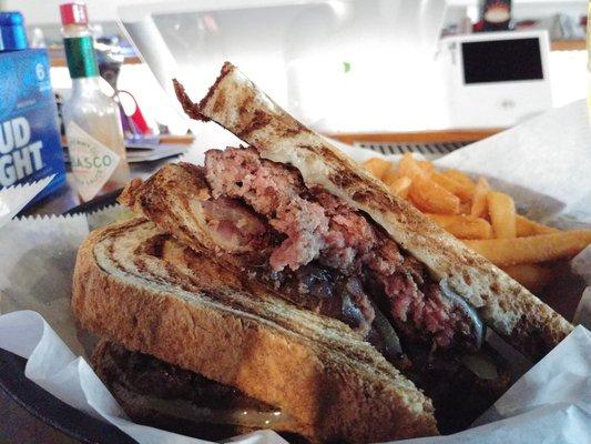 The patty melt with fries.