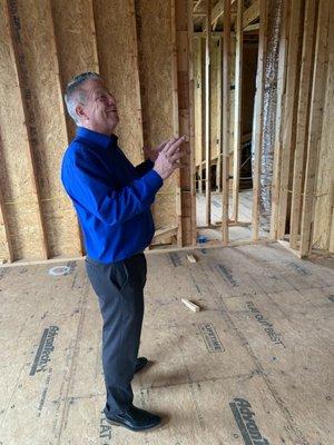 David M, head of our new construction team, checking the progress of the installation of an HVAC system we're working on in this new home.