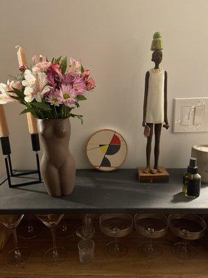 I bought the vase, small round artwork, woman figure and hand sanitizer spray all from the store.