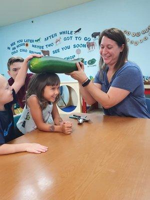 Teacher Julie brought in a giant zucchini from her garden for the kids to cut up and eat