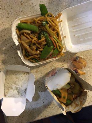 Chicken and broccoli dinner with white rice and vegetable lo mein