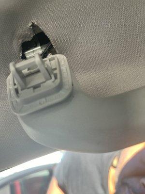 Passenger side grab handle that is now useless. The attachments were broken or stripped by dealers mechanic.