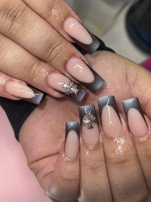 Sleek and chic with a twist!  Loving these black French tips for an edgy look."
By Nancy