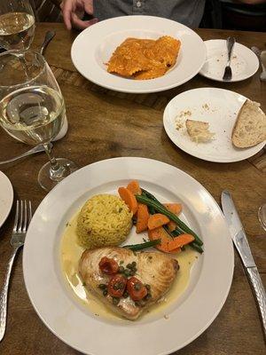 Braised beef ravioli with crabmeat and swordfish in a lemon wine sauce with capers and roasted tomatoes and veggies