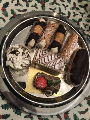 Fresh filled Cannoli, Napoleon, Eclair, Tiramisu, and mini Bouche de Noel