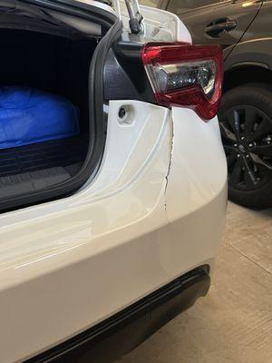 Rear bumper damage prior to repair