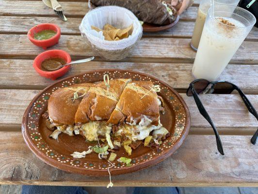 Torta de Pastor, horchata, and chips.