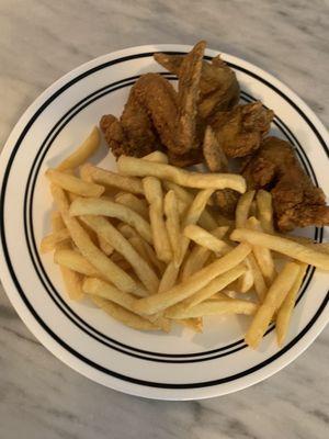 Plated wings and fries ... also came with bread...