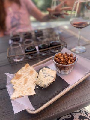 First visit, we will be back! Flight of four wines. Snacks "maple glaze peanuts & bacon", chunk of cheese "Roth s moody, blue"! EXCELLENT!