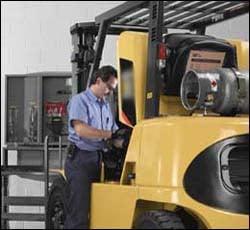 Broward County forklift driver performs routine check