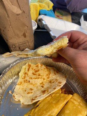 Quesadilla has all the cheese bundled up to one side, half the quesadilla is empty and the cheese isn't thoroughly melted....